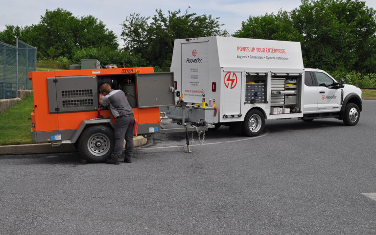 HooverTec servicing air compressor on job site.